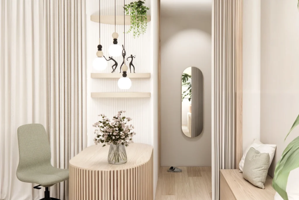 Minimalističen recepcijski kotiček wellness centra z lesenim pultom, dekorativnimi svetili, rastlinami in toplimi naravnimi materiali.