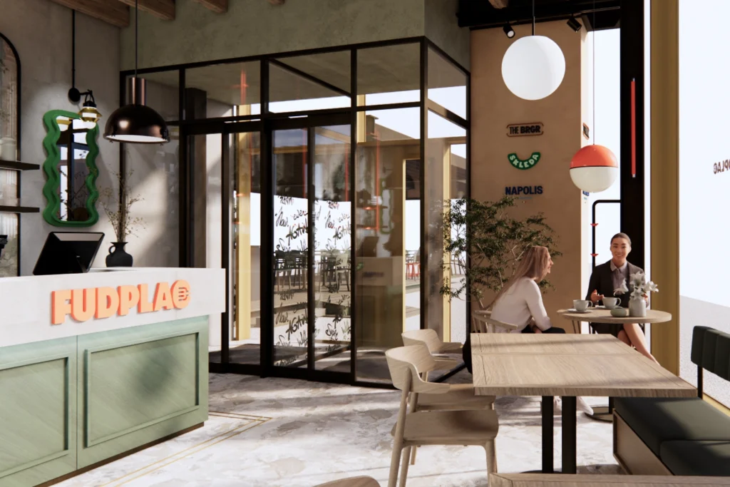 Vhodni del moderne restavracije z recepcijskim pultom, steklenim vetrolovom, toplimi svetili in sedežnim kotičkom za goste.
